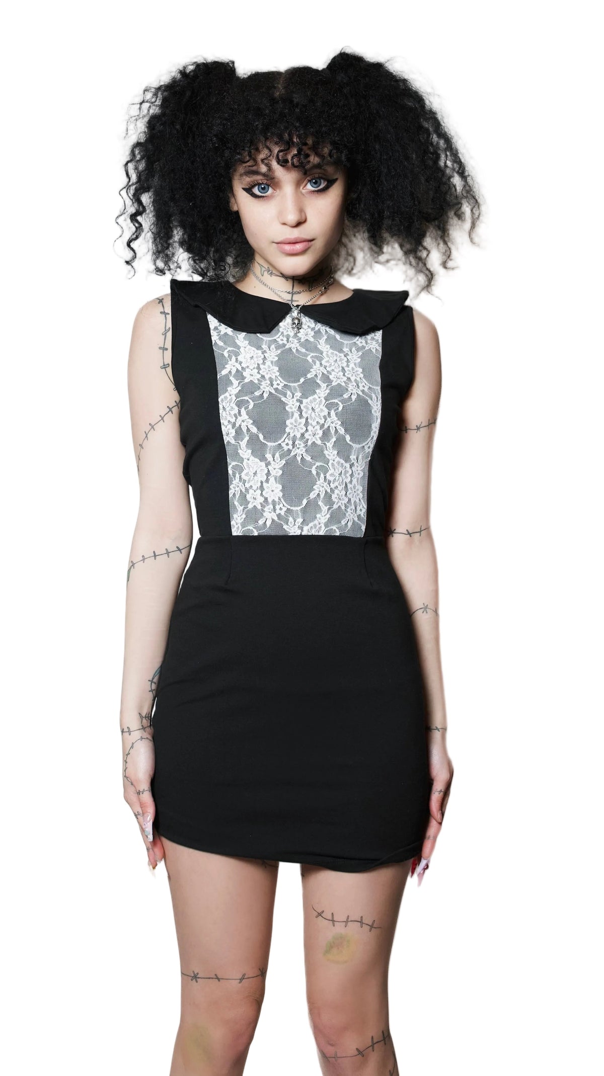 Person wearing a black dress with white lace details on a white background