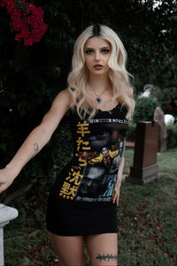 Woman wearing a black tank top with graphic design in an outdoor setting