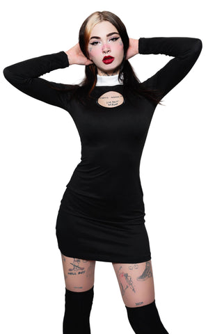 Person wearing a black dress with a visible brand label on a white background