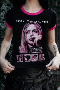 Person wearing a black t-shirt with graphic design and text