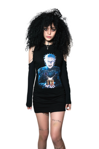 Person wearing a black sleeveless top with a graphic design on a white background