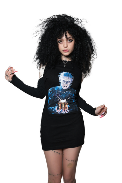 Person wearing a black long-sleeve shirt with a graphic design on a white background