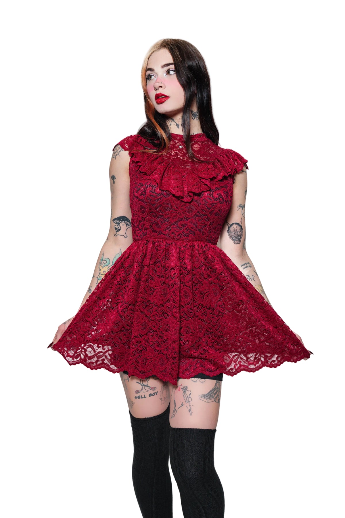 Woman wearing a red lace dress on a white background