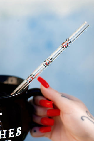 Cup with glass clear straw. Straw features  Eyecandy company logo pattern with "EYECANDY" written in black.