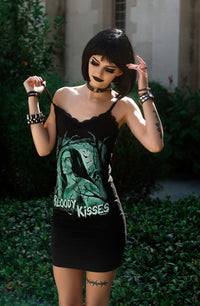 Black thin strap mini dress with black lace trim neckline. Features green print image of Peter Steele with trees in background. Green inscription reads "BLOODY KISSES"