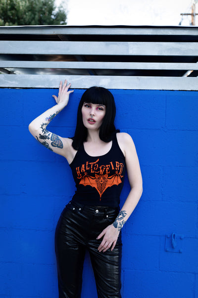 Black cropped tank with orange font that reads "Halloweird" with orange bats