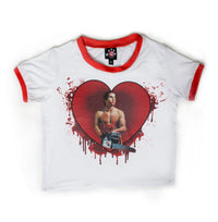 solid white ringer tee with red trim and American Psycho print. Man holding chainsaw in red heart with blood
