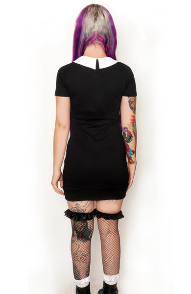 Back view of short sleeve mini dress with white collar.
