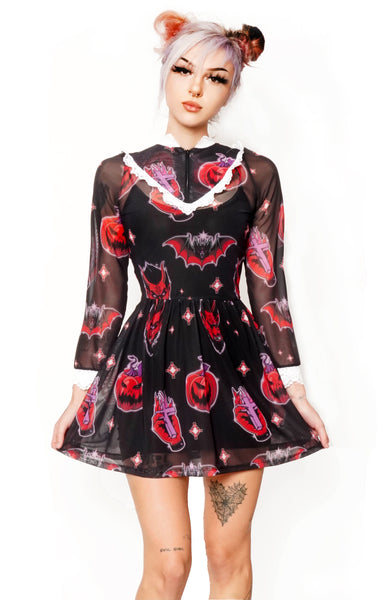 Sheer black Victorian style dress with white lace trim neckline and wrist cuffs. V shape lace trim from chest to shoulders. Black zipper from neckline to V shape white lace trim. Features devil, bat, pumpkin, hand with cross pattern.