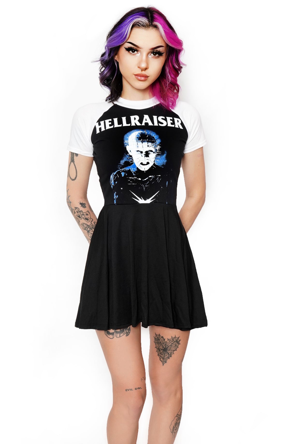 Black baby doll style dress with white baseball short sleeves and white trim neckline. Features Pinhead from the movie Hellraiser. Inscription in white reads "Hellraiser".