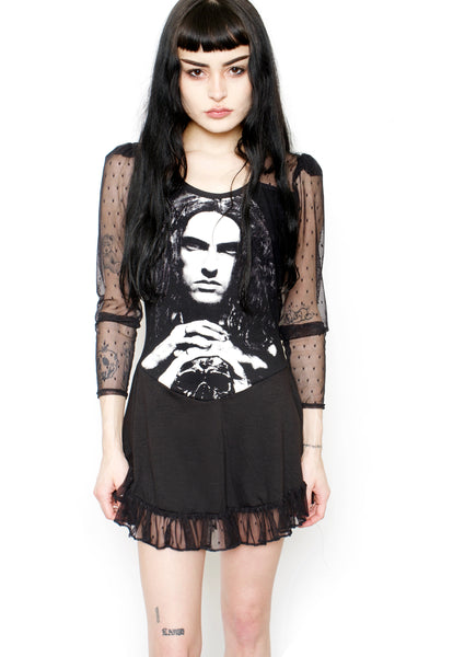 Black ballerina style dress with mesh polka dot long sleeves and mesh polka dot trim at bottom of dress. Features white image of Peter Steele looking straight ahead with hands on skull.