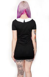 Back of black mini dress with white collar.