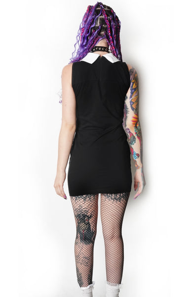 Back of black mini dress with white collar. Black zipper on upper back.