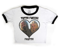 White ringer tee with black trim. Inscription in black reads "TUTTI FUCKING FRUTTII". Features picture of Otis and Baby from the movie "The Devil's Rejects" inside a heart shape.