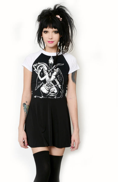 Black baby doll style dress with white baseball tee short sleeves and white trim neckline. White print on dress features Baphomet goat.