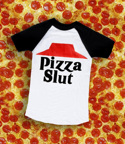 White baseball tee with black short sleeves and black trim neckline. Features image of red hat with black inscription "PIZZA SLUT".