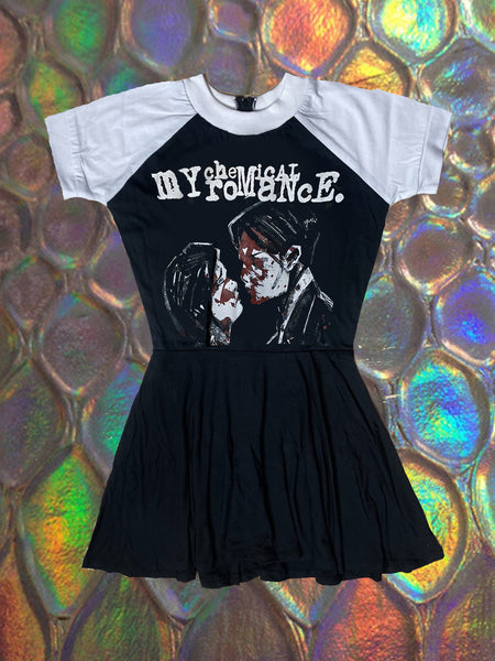black baby doll mini dress with white short sleeves. features white image of man and woman facing each other with res blood on their faces. Inscription reads "my chemical romance." in white