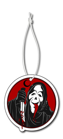 Circle air freshener with white elastic band. Features Ghostface from the movie Scream with his tongue out, holding a bloody knife in one hand and doing the hand loose sign in other hand. Crescent black moon shown above Ghostface and red in background.
