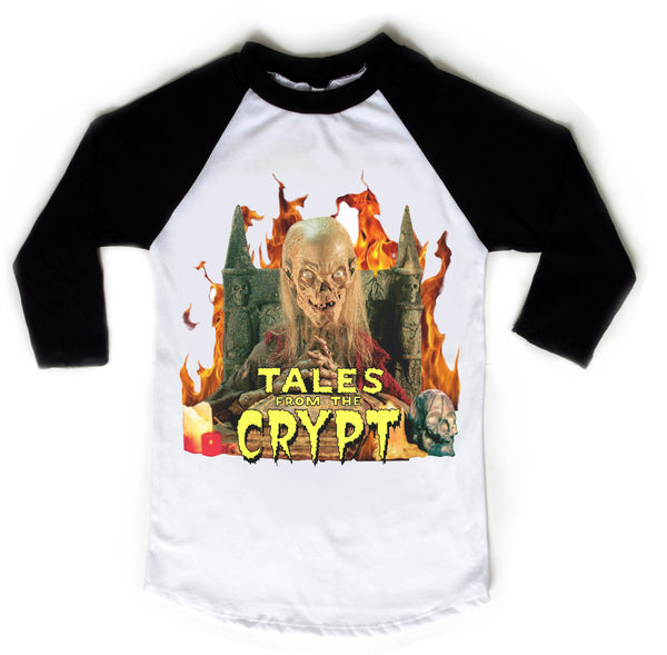 White baseball tee with black sleeves and black trim neckline. Features Skeleton sitting on thrown with hands clasped and flames in background. Inscription reads "TALES FROM THE CRYPT" in yellow.