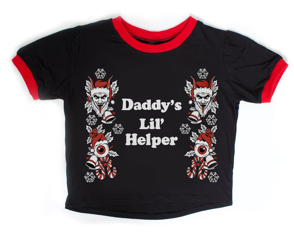 Black ringer tee with red trim. Print features evil holiday elves with snow, candy canes, and eyeballs. White font reads "Daddy's Lil' Helper".