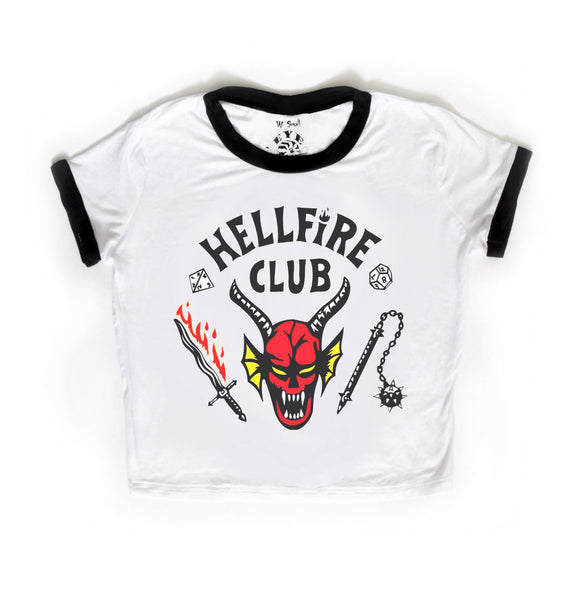 White short sleeve ringer tee with black trim. Features image of devil's head at center with bloody sword and a flail. Inscription reads "HELLFIRE CLUB" in white.