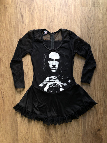 Black ballerina style dress with mesh polka dot long sleeves and mesh polka dot trim at bottom of dress. Features white image of Peter Steele looking straight ahead with hands on skull.