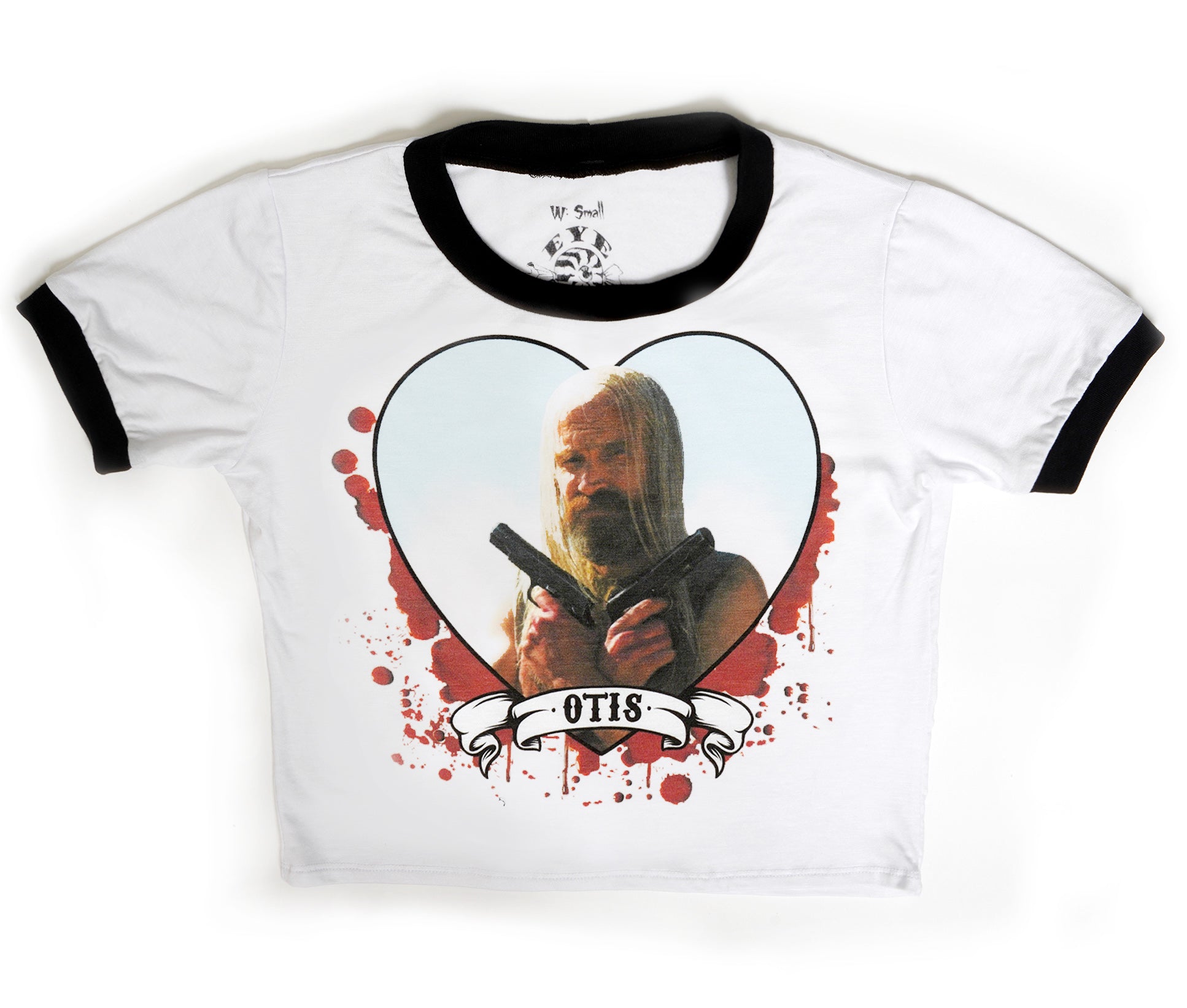 White ringer tee with black trim. Features picture of Otis from the movie "The Devil's Rejects" holding two guns across his chest inside a heart shape. Behind the heart there is red blood splatter and a banner on bottom of hearts that reads "OTIS" in black.