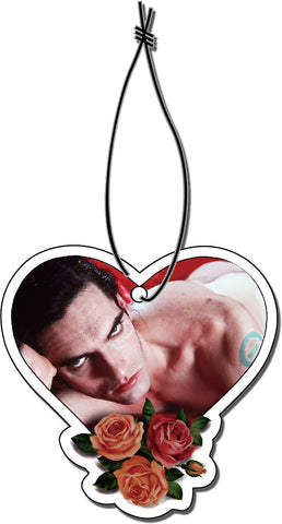 Heart shaped air freshener with white elastic band. Features image of Peter Steele laying in bed with red sheets. Roses at bottom of heart.
