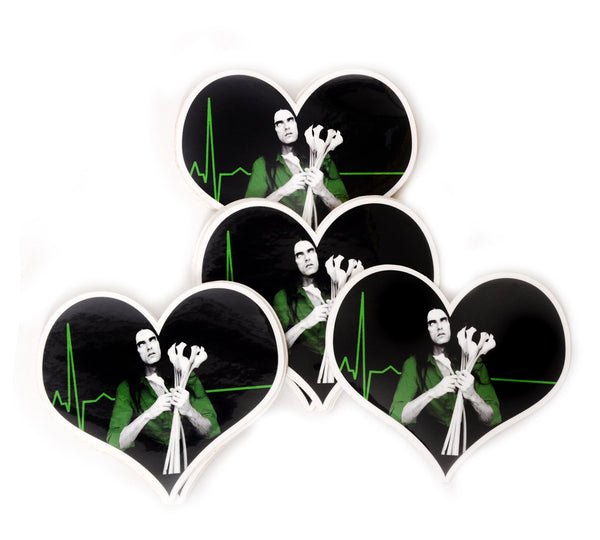 Heart shape vinyl sticker. Features white image of singer Peter Steele with eyes rolled up, wearing a green shirt and holding white flowers. Green electro cardio gram in background.