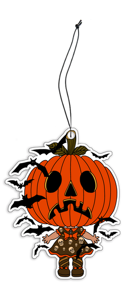 Air Freshener with black elastic band. Features jack o lantern head wearing a dress with skulls and orange trim, orange collar and orange bow. Black bats flying around.