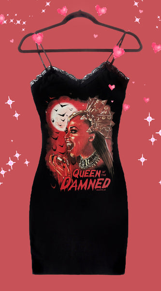 Black thin strap dress with black lace trim neckline. Features red printed image of Queen Akasha from the movie Queen of the Damned with mouth open displaying fangs. Full moon and bats in background.