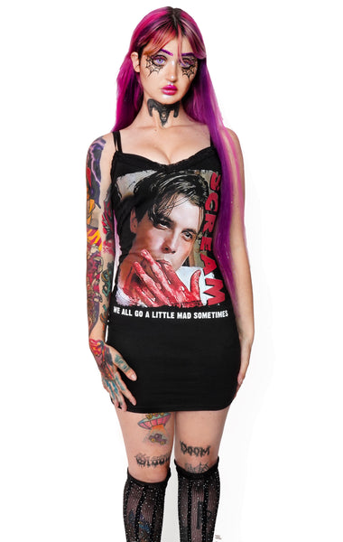 Black thin strap mini dress with black lace trim neckline. Features image of Billy from the movie Scream sucking on bloody fingers. Inscription reads "SCREAM" in red and "WE ALL GO A LITTLE MAD SOMETIMES" in white.
